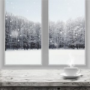 Coffee cup on window sill on a snowy day