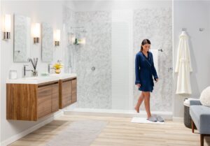 woman in robe getting out of new shower
